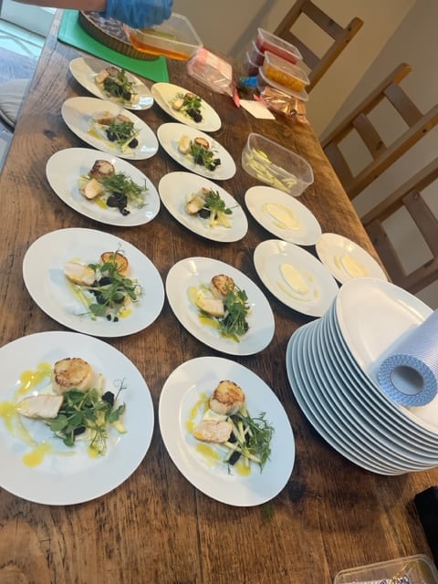 A plated seafood course prepared for an intimate wedding dinner