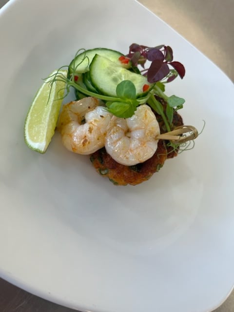 A prawn starter with lime and fresh herbs