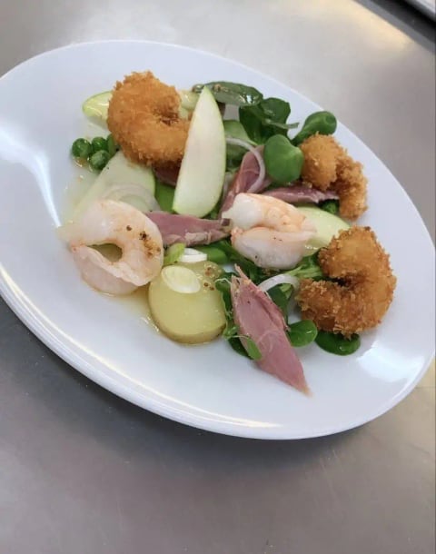 A carefully plated course for a dinner party