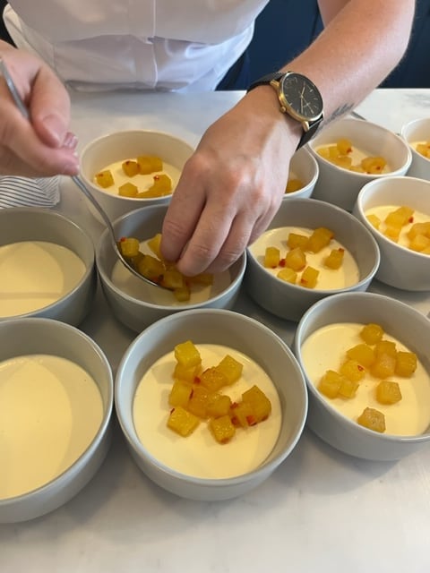 A custard dessert finished with glazed fruit
