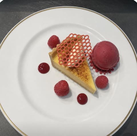 Raspberry tart served with raspberry sorbet and honeycomb