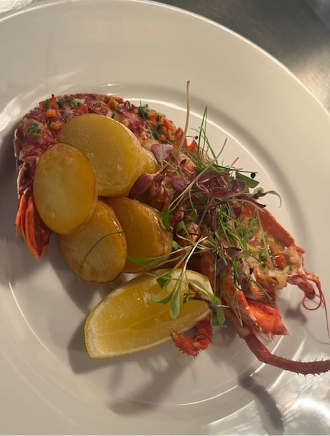 Lobster served with new potatoes, herbs and lemon